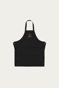 Andre Blunt organic cotton apron in black with embroidered wheel of peace