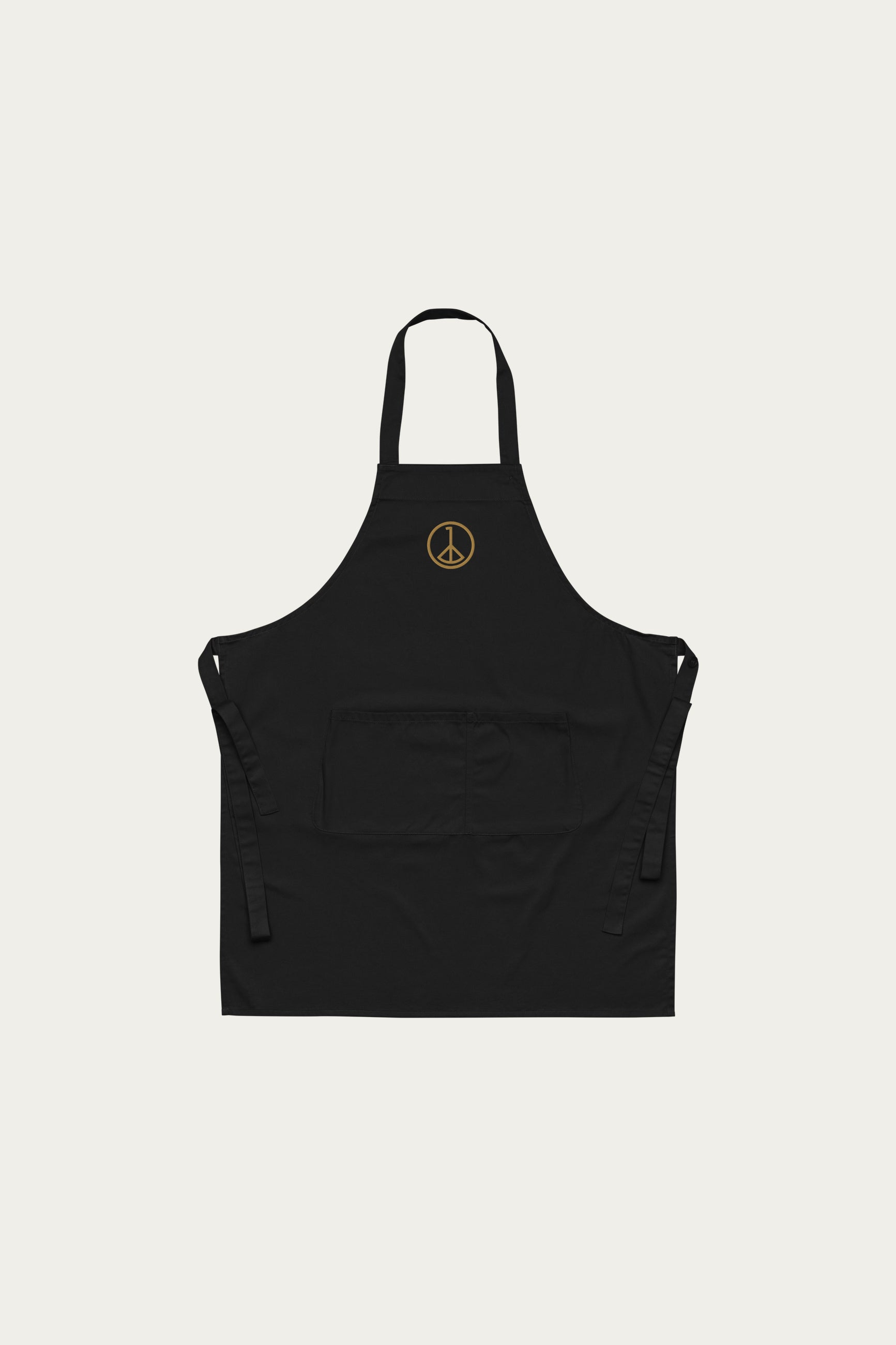 Andre Blunt organic cotton apron in black with embroidered wheel of peace