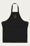 Cotton Apron in Black by Andre Blunt, shown on a Cloud White ground