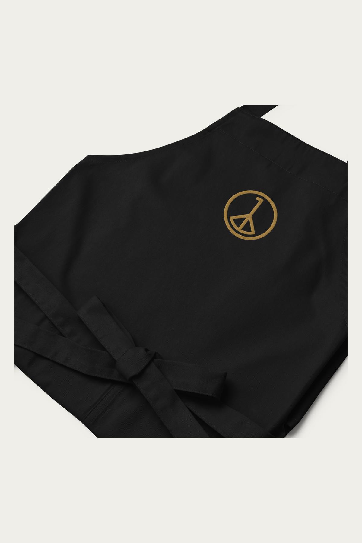 Cotton Apron in Black by Andre Blunt, detail, on a Cloud White ground