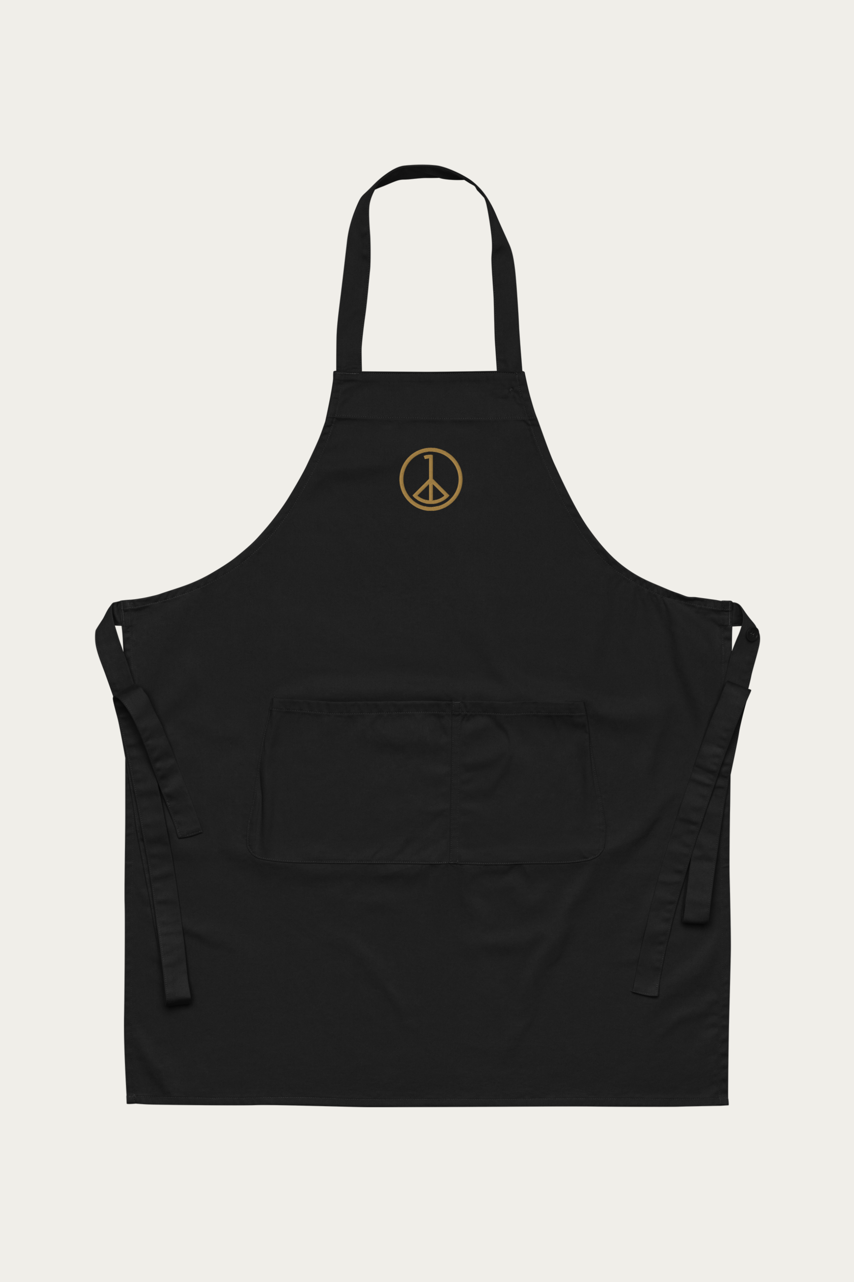 Cotton Apron in Black by Andre Blunt, shown on a Cloud White ground