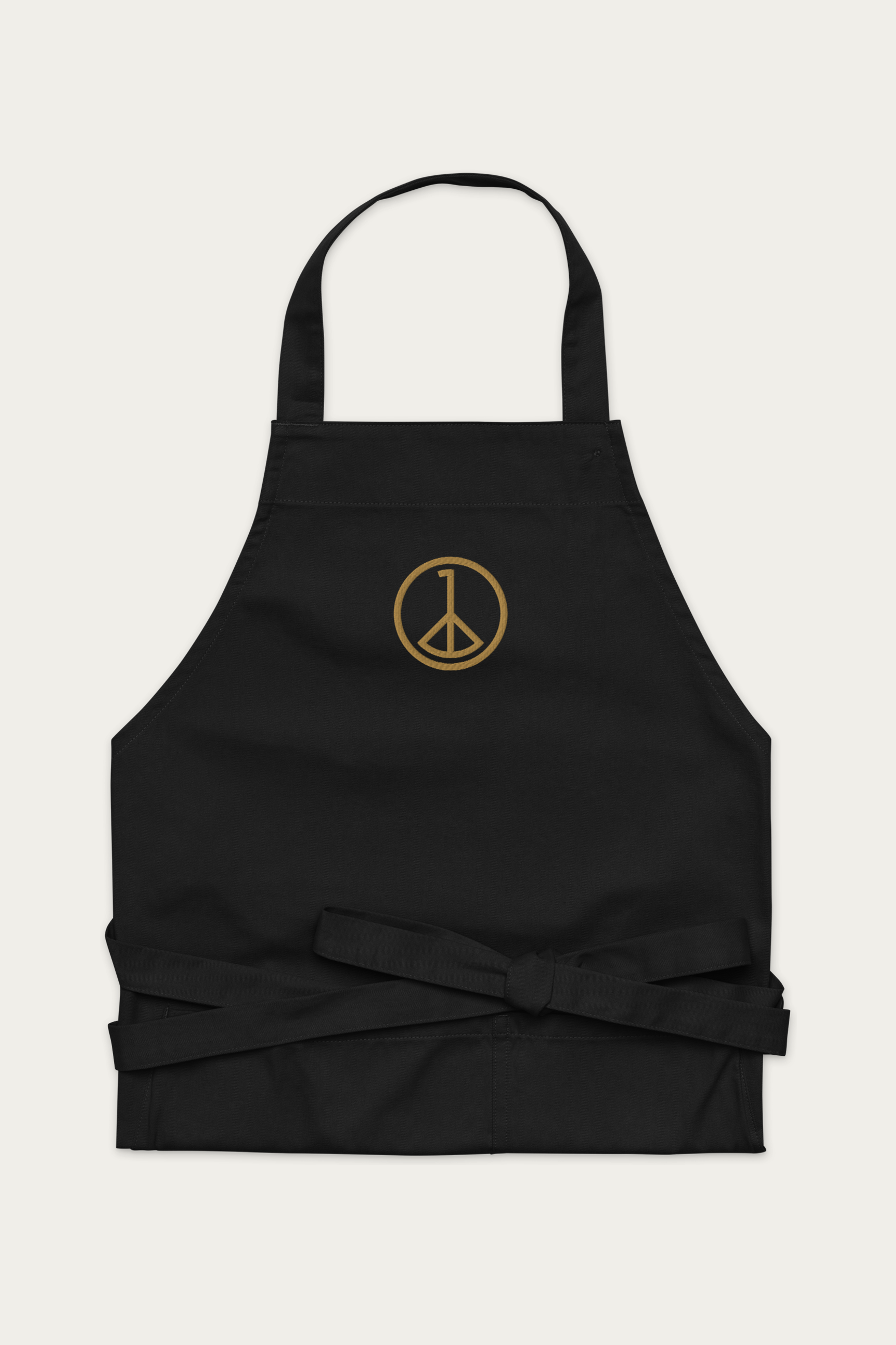 Cotton Apron, Black by Andre Blunt, shown on a Cloud White ground