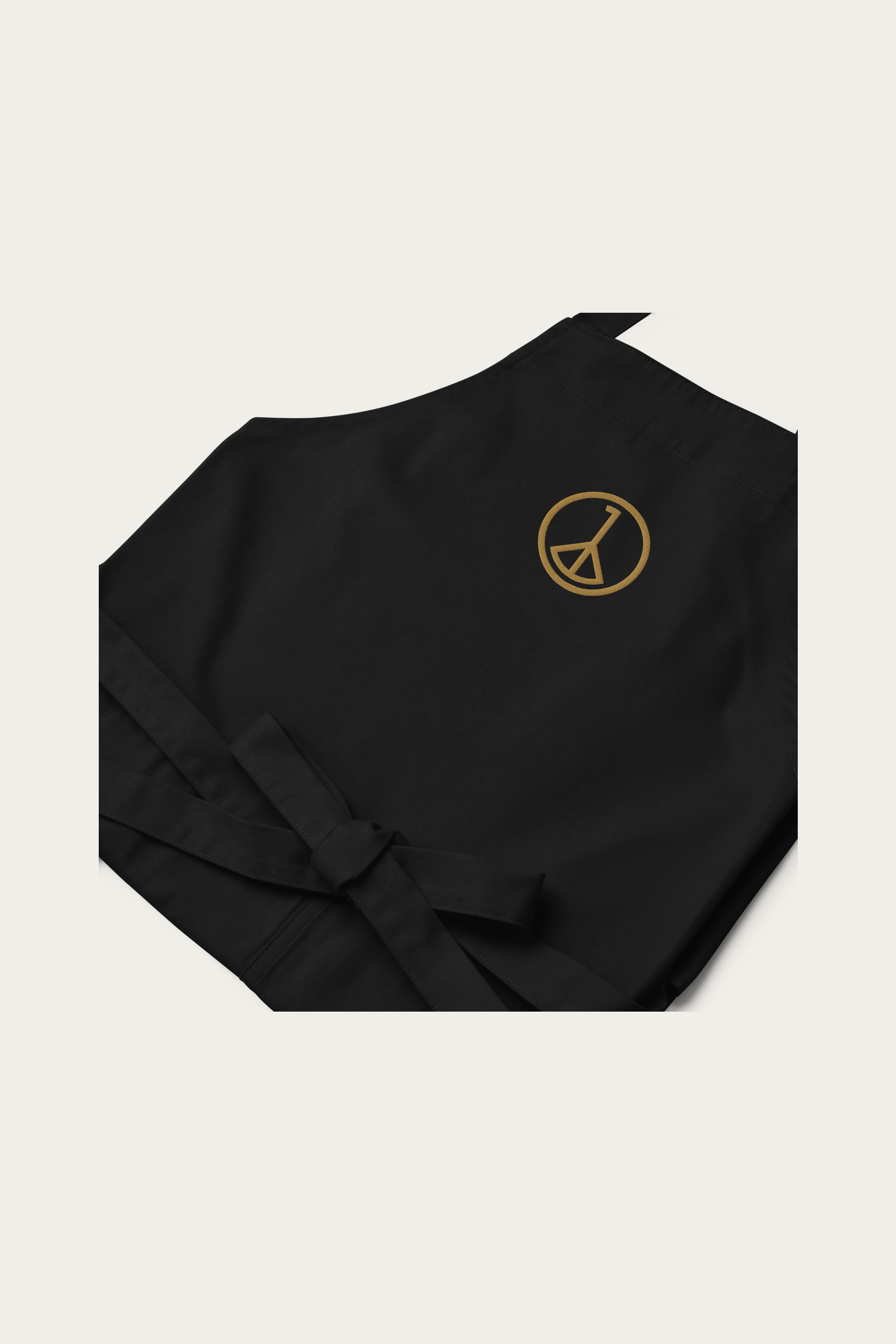 Cotton Apron in Black by Andre Blunt, detail, on a Cloud White ground