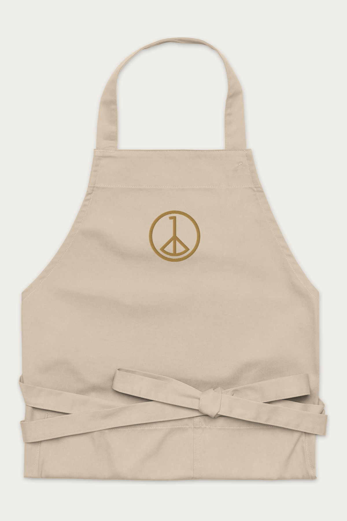 Andre Blunt cotton apron in natural, folded, on a Cloud White ground