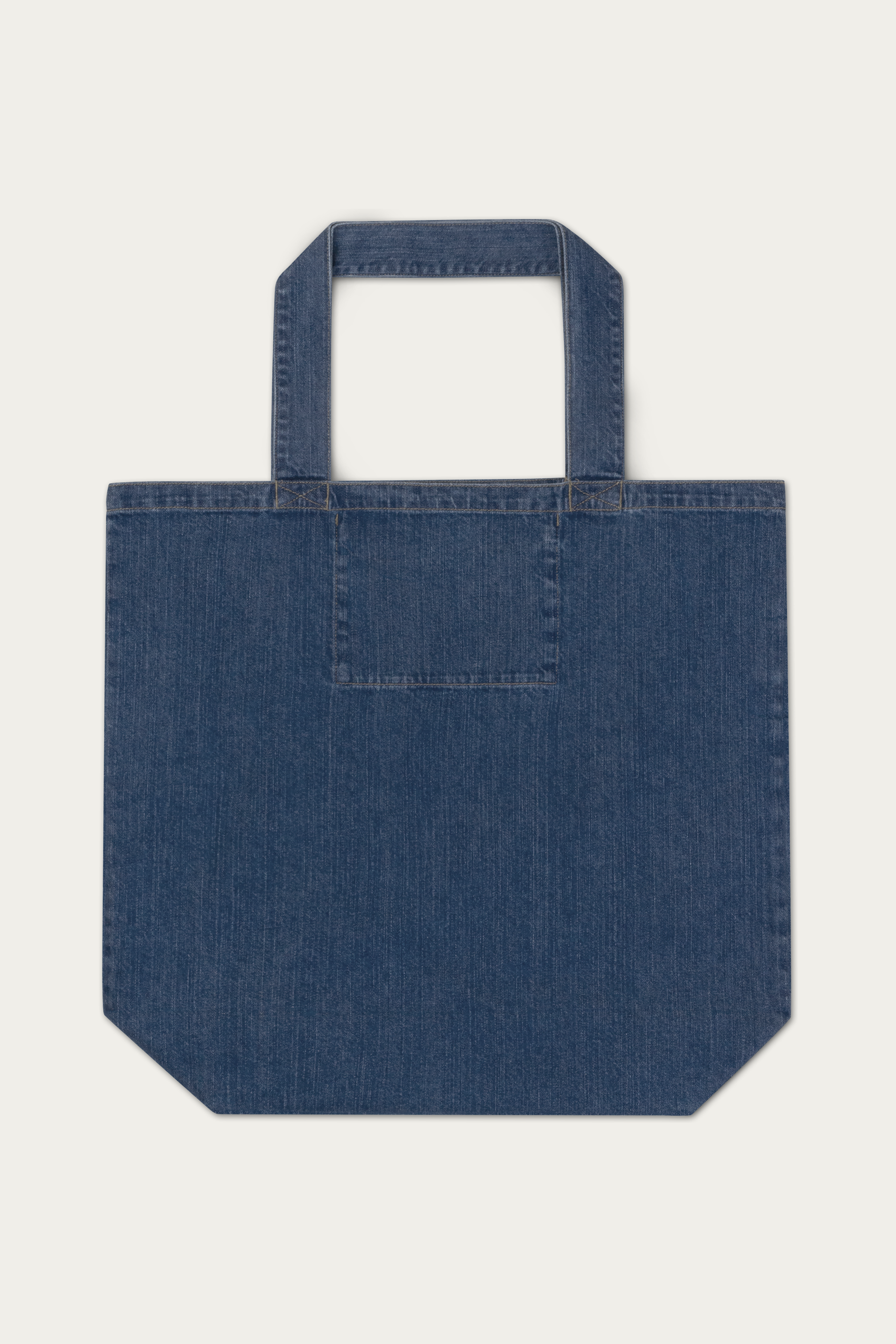 Denim Tote Bag by Andre Blunt, from the back, on a Cloud White ground