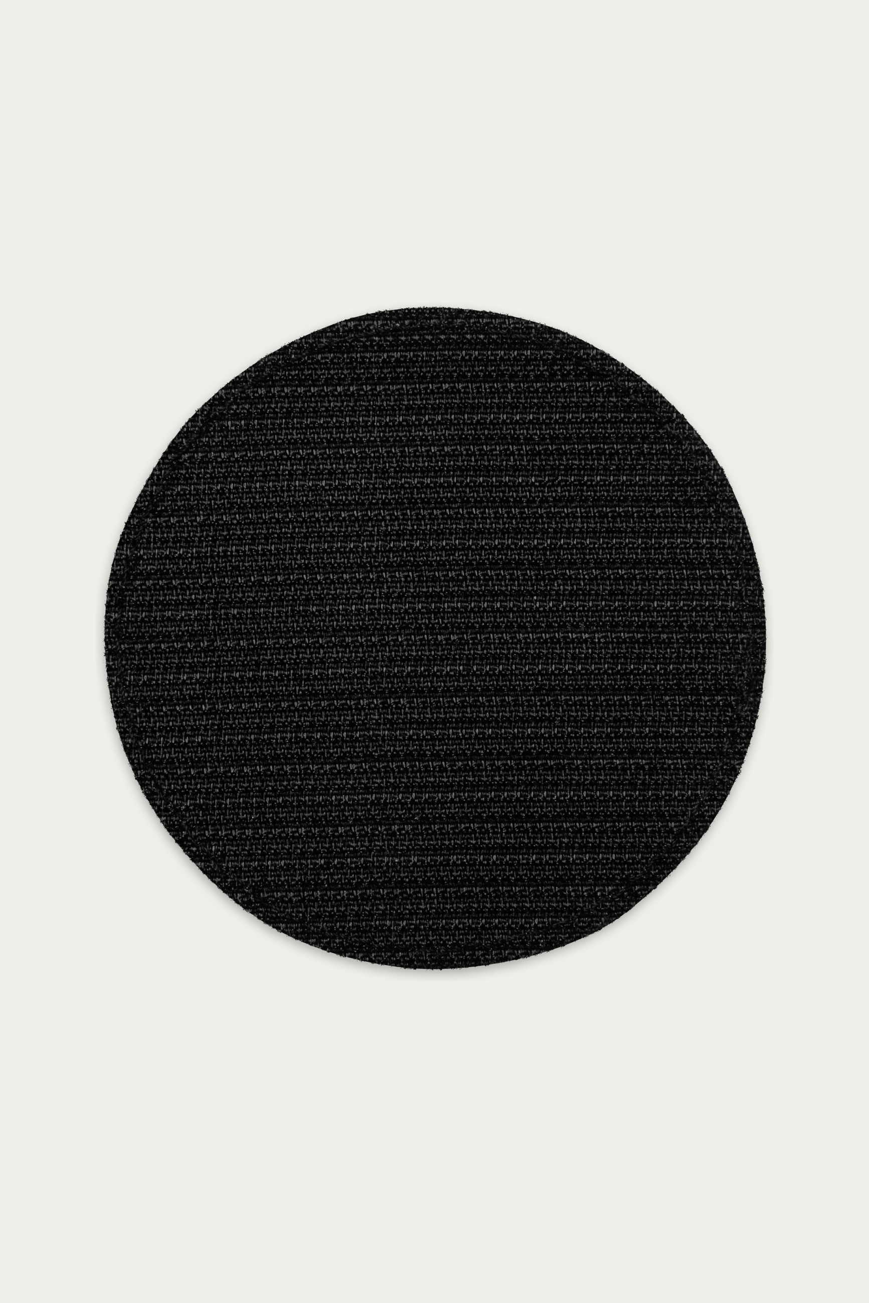 Embroidered Patch, Black by Andre Blunt, from the back, on a Cloud White ground