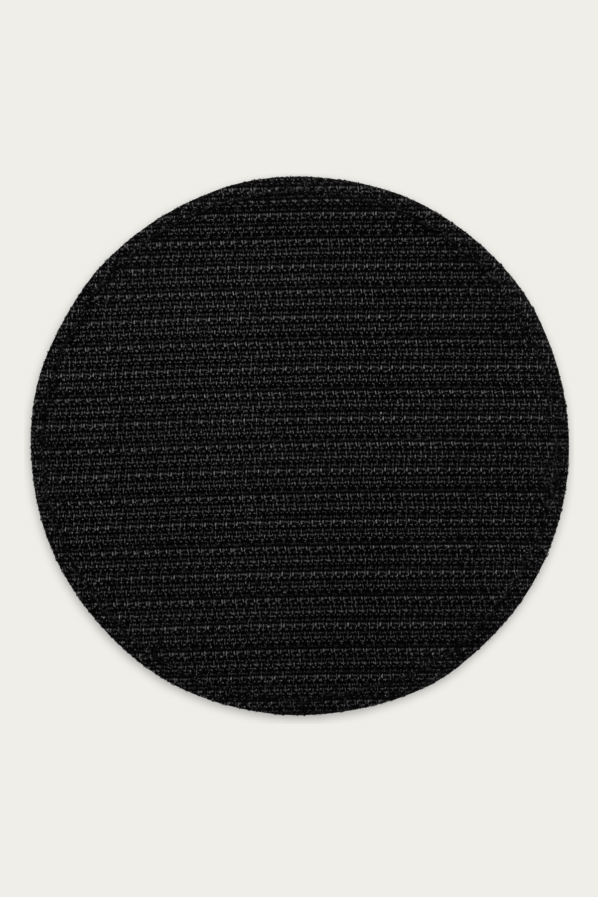 Embroidered Patch, Black by Andre Blunt, from the back, on a Cloud White ground