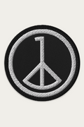 Embroidered Patch, Black by Andre Blunt, shown on a Cloud White ground