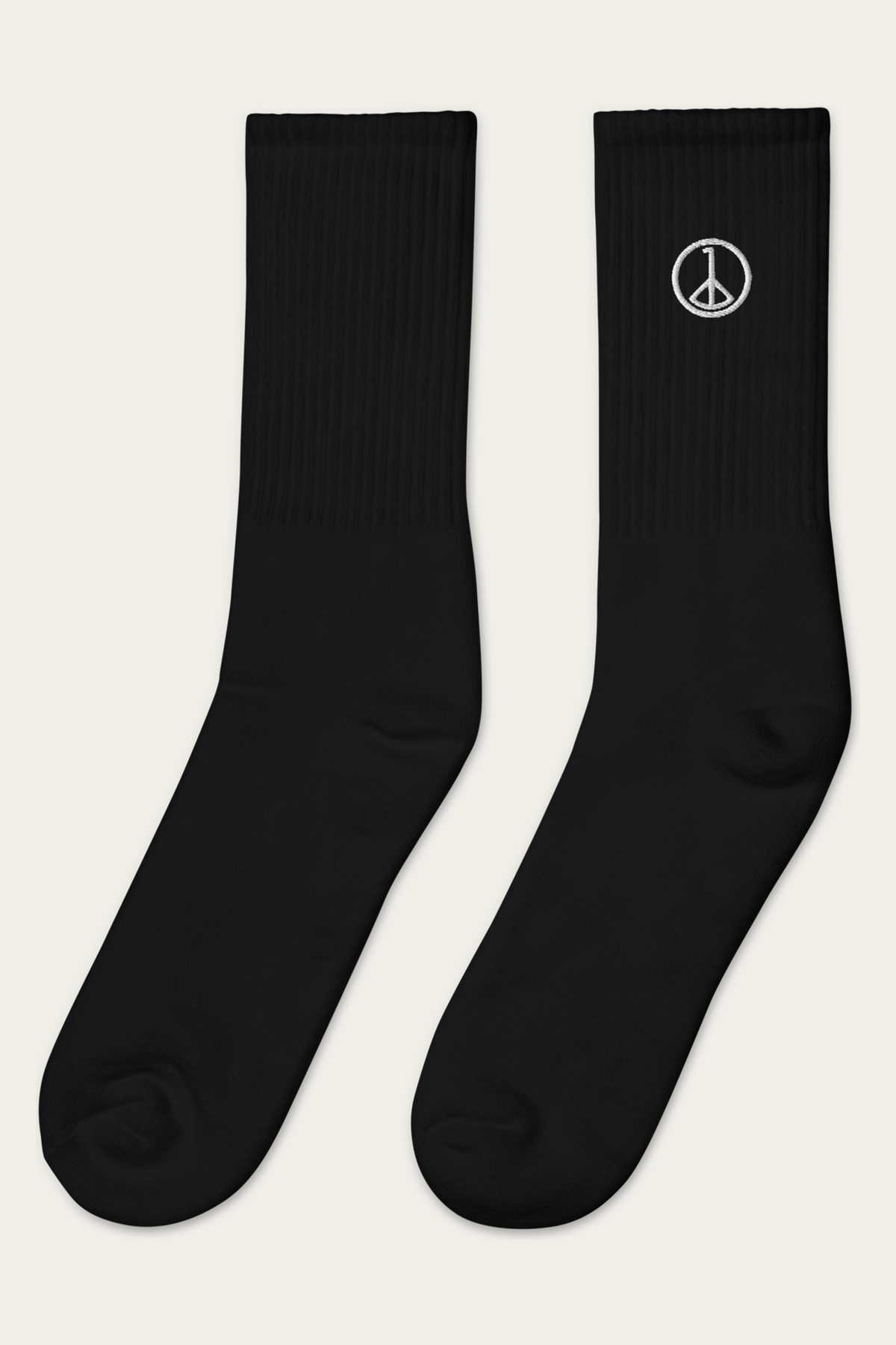 Embroidered Socks, Black by Andre Blunt, from the left, on a Cloud White ground