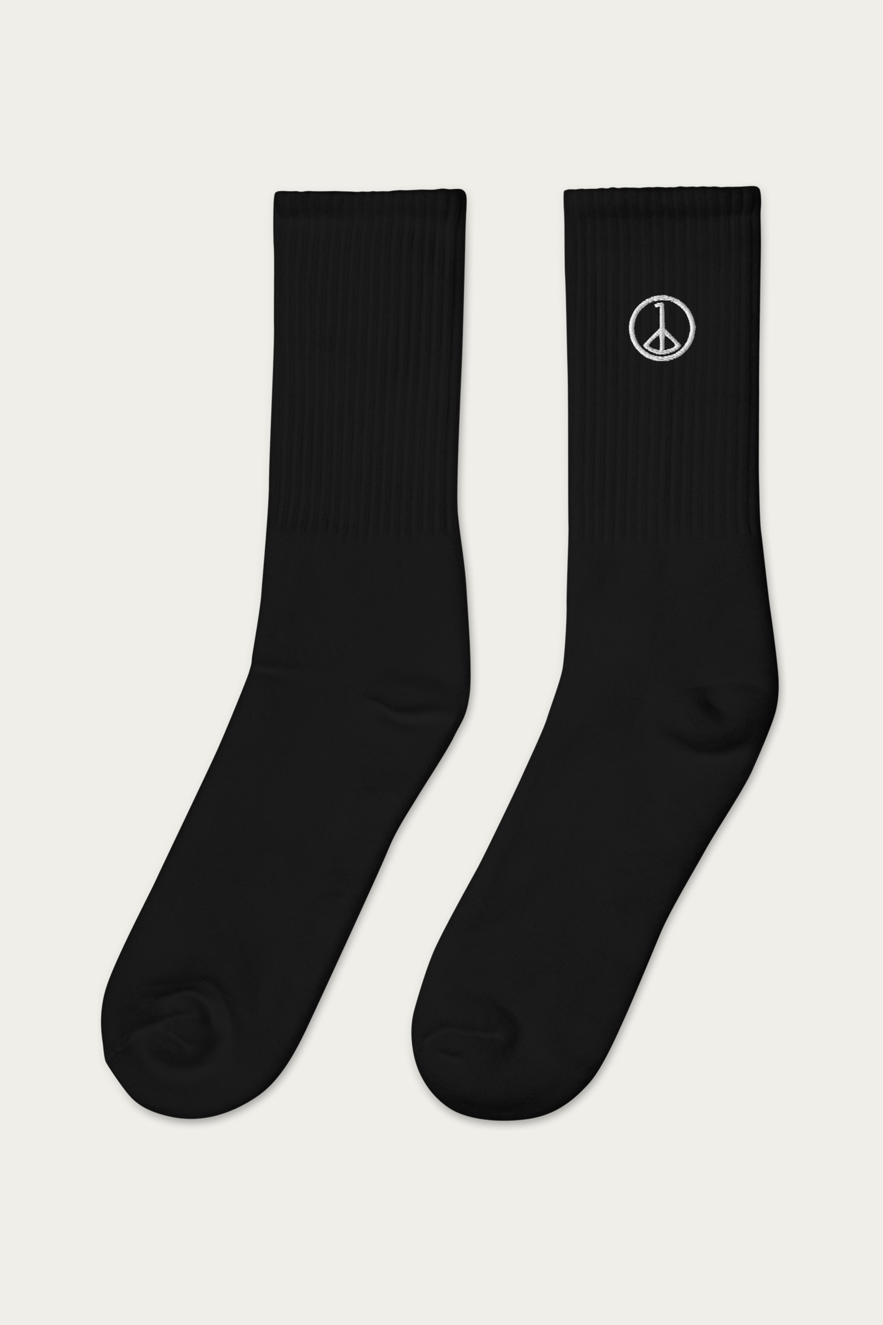 Embroidered Socks, Black by Andre Blunt, from the left, on a Cloud White ground