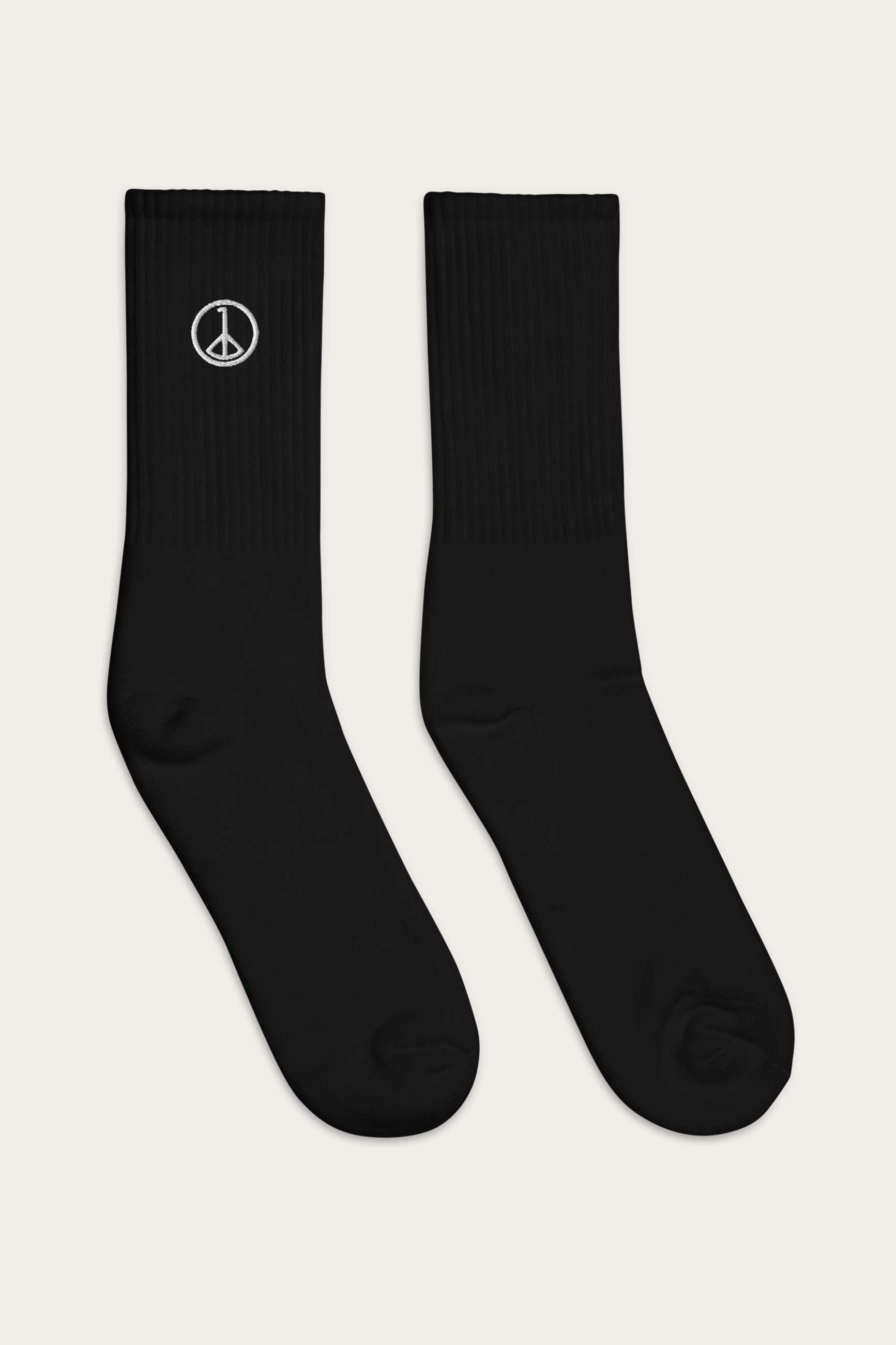 Embroidered Socks, Black by Andre Blunt, from the right, on a Cloud White ground