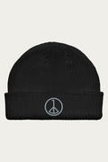 Fisherman Beanie in Black by Andre Blunt, shown on a Cloud White ground