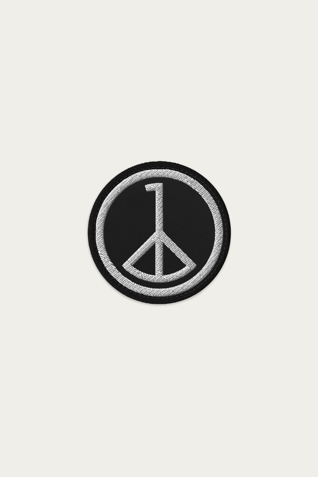 Andre Blunt embroidered wheel of peace patch in black