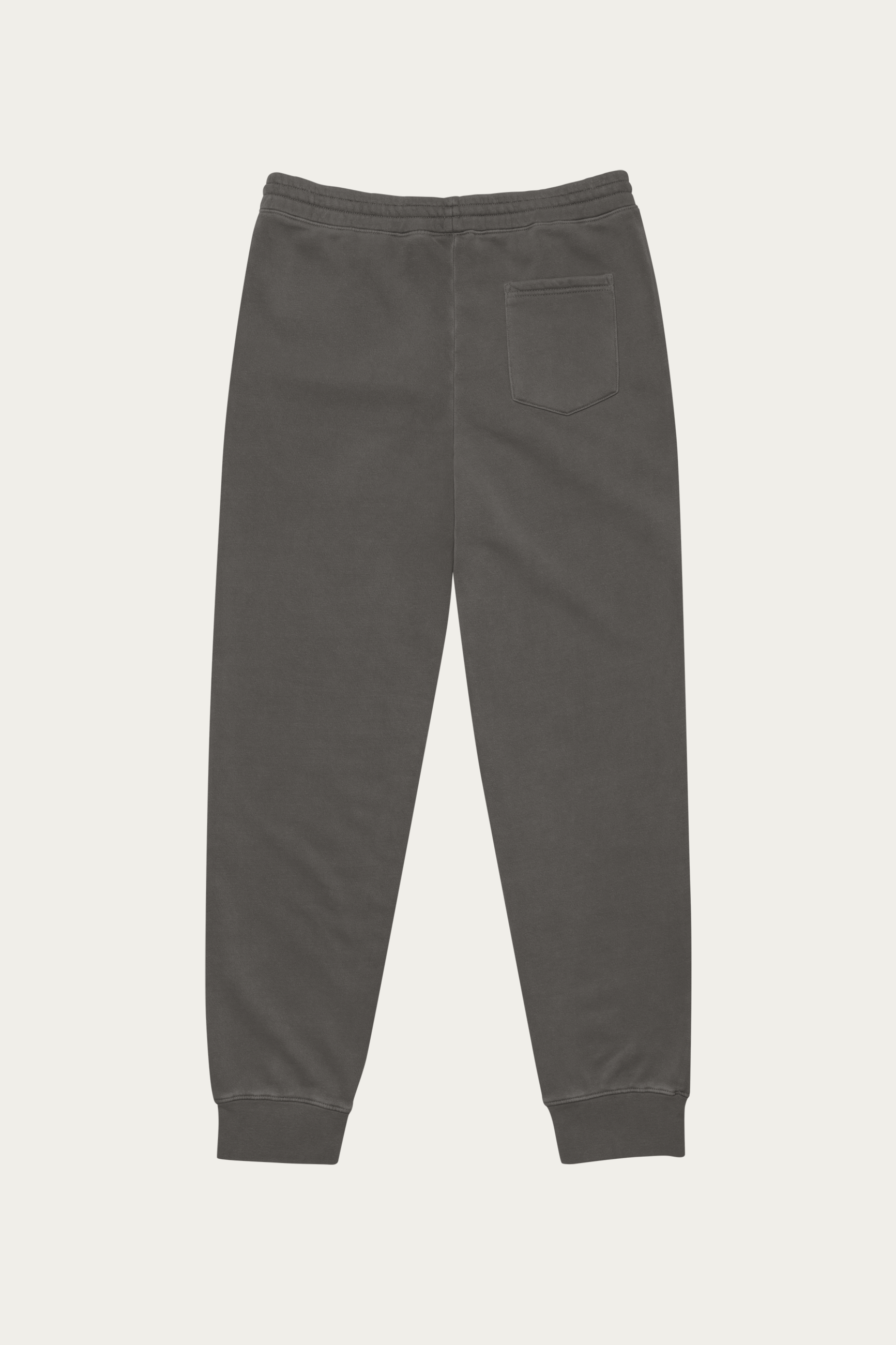 Pigment-Dyed Sweatpants, Black by Andre Blunt, from the back, on a Cloud White ground