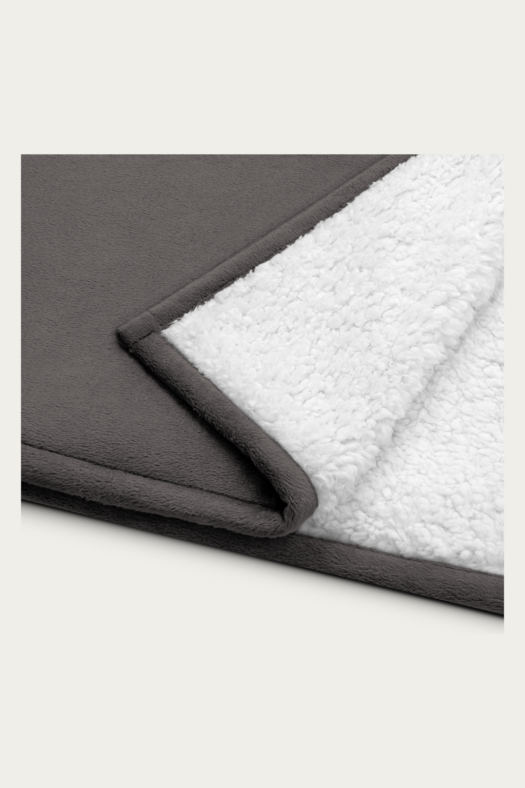 Sherpa Blanket, Grey by Andre Blunt, folded corner showing the sherpa reverse, on a Cloud White ground