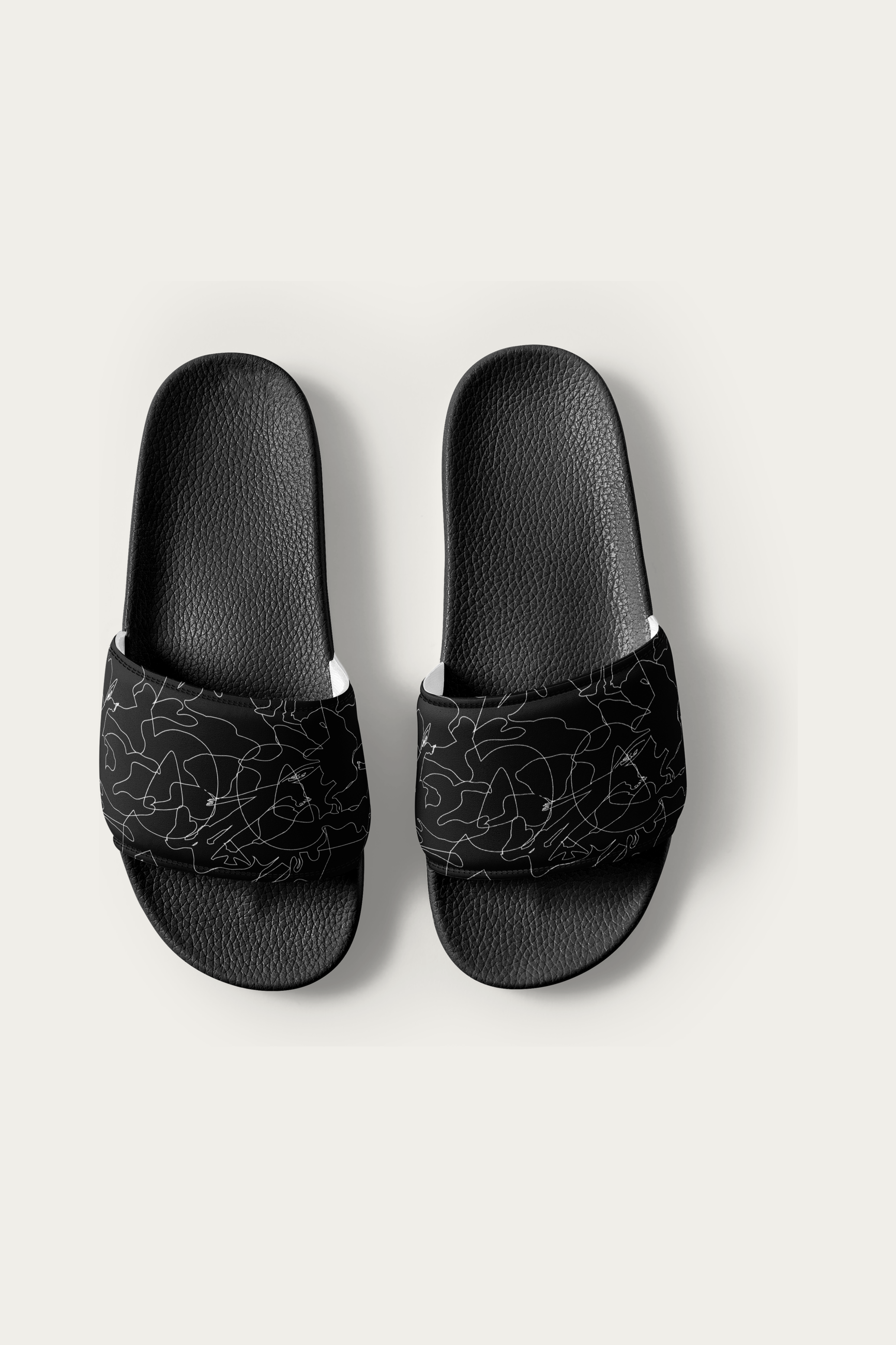 Slides, Black by Andre Blunt, shown on a Cloud White ground