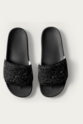 Slides, Black by Andre Blunt, shown on a Cloud White ground