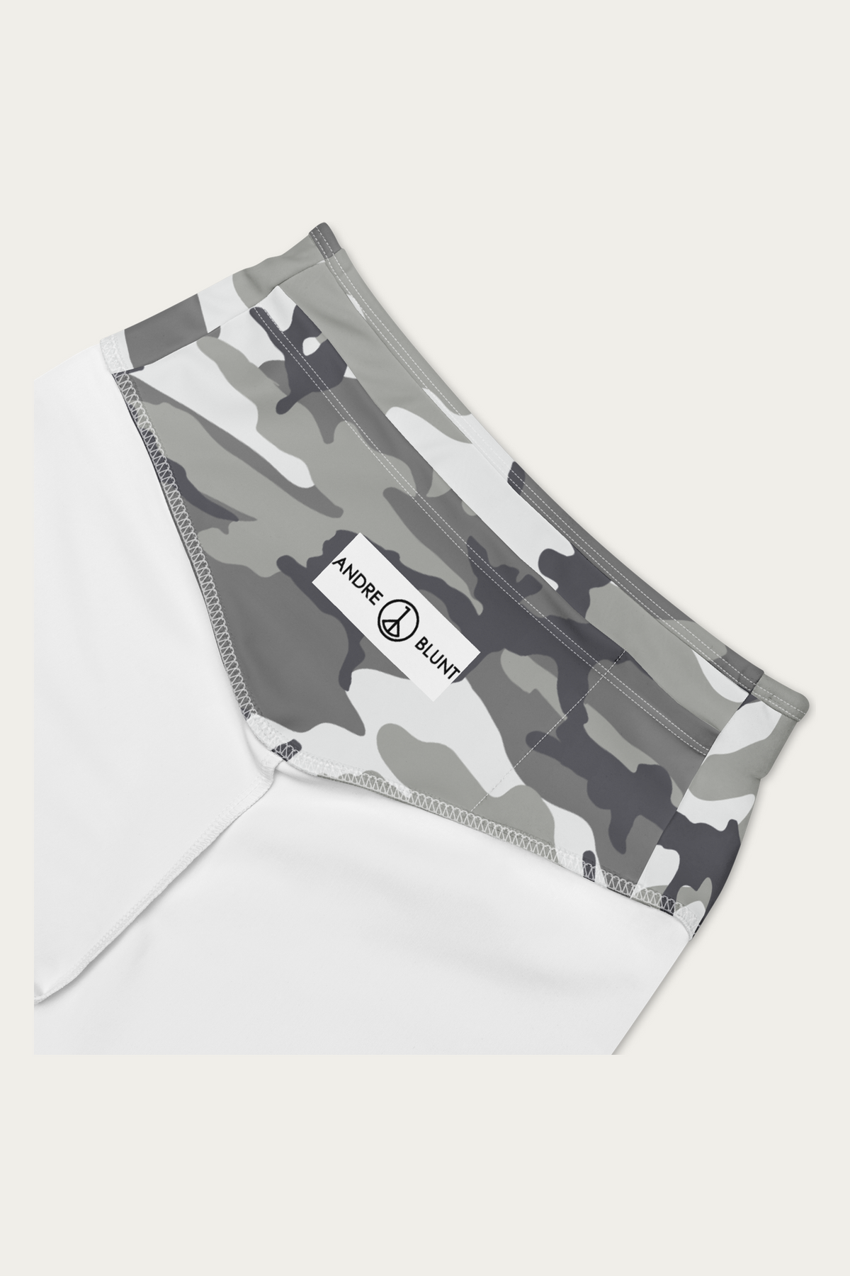 Snow Camo Biker Shorts by Andre Blunt, detail, on a Cloud White ground