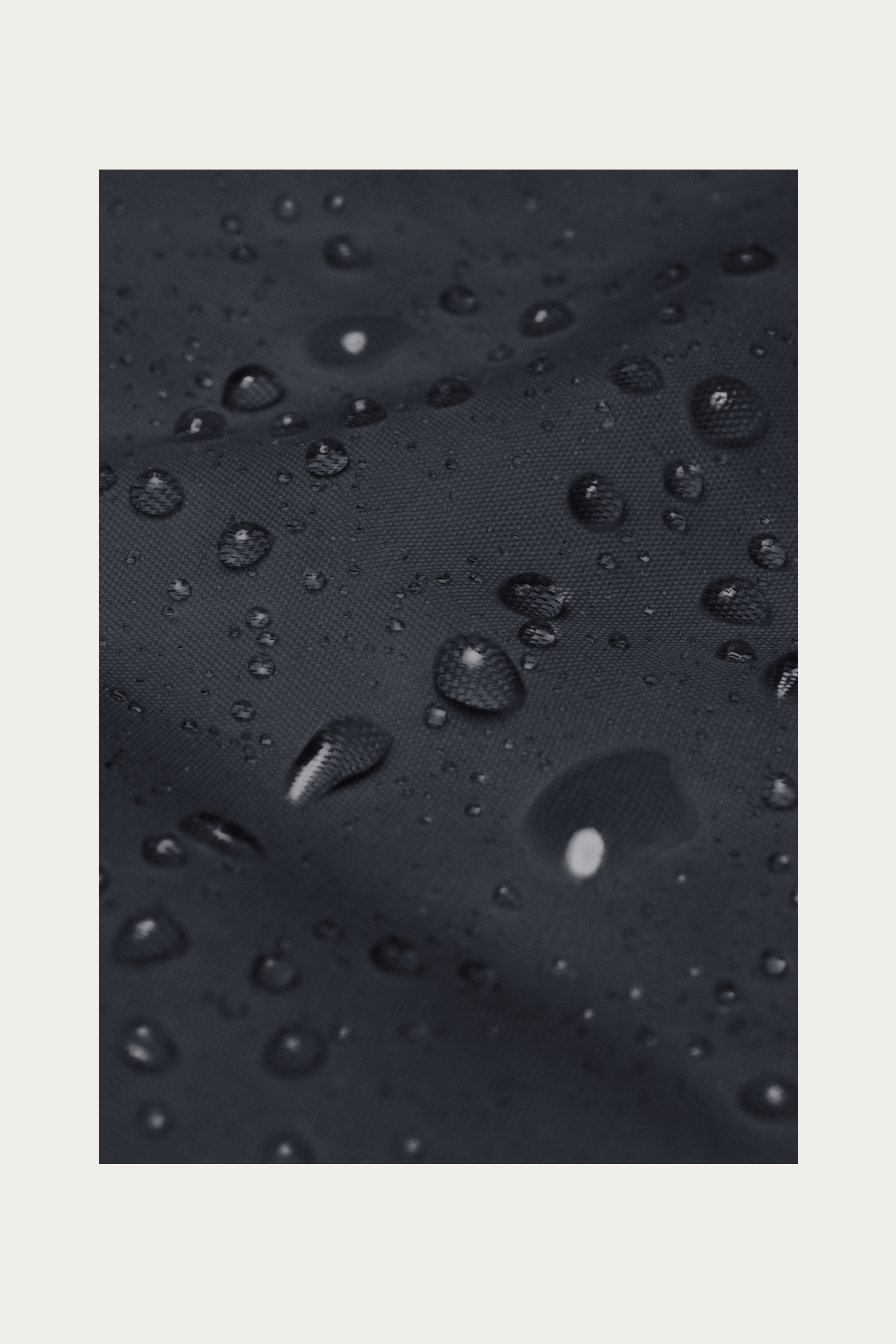 Windbreaker, Navy by Andre Blunt, water beading on the shell, on a Cloud White ground