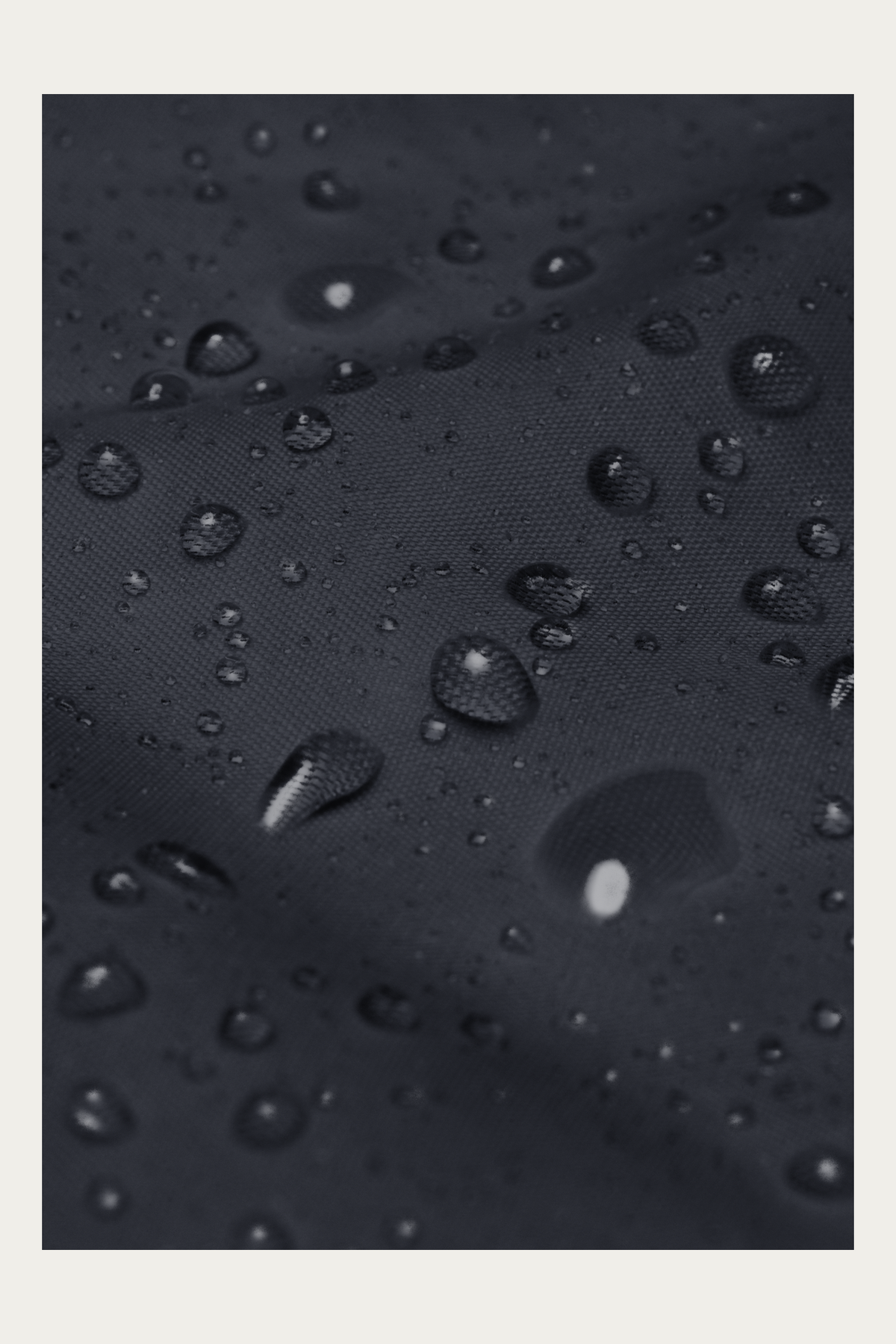 Windbreaker, Navy by Andre Blunt, water beading on the shell, on a Cloud White ground