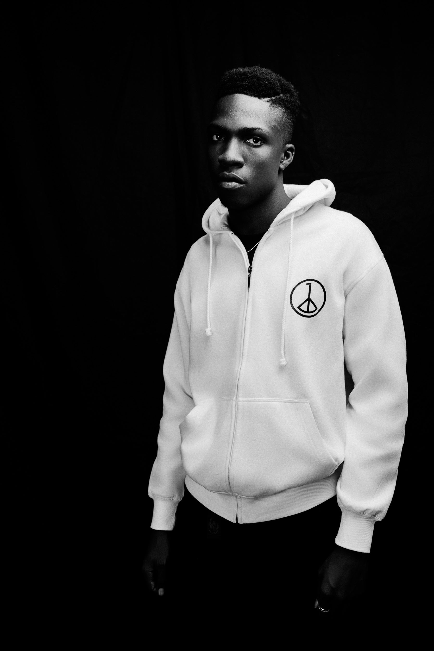 Andre Blunt off-white zip-up hoodie, editorial